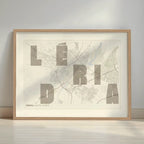 Framed Lerida in Unruled design, where the city name letters appear randomly across different lines for a truly original urban layout designed in light brown and an off-white background with a white margin border in a warm lit minimalist setting