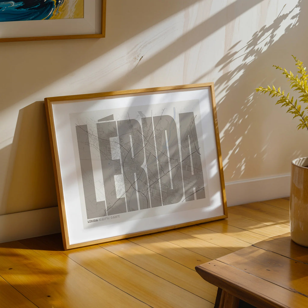 Modern interior design with a Lerida in Extra Compressed design, where the letters are tightly squeezed to fit the city's map shape designed in light brown and an off-white background, displayed on a living room wall