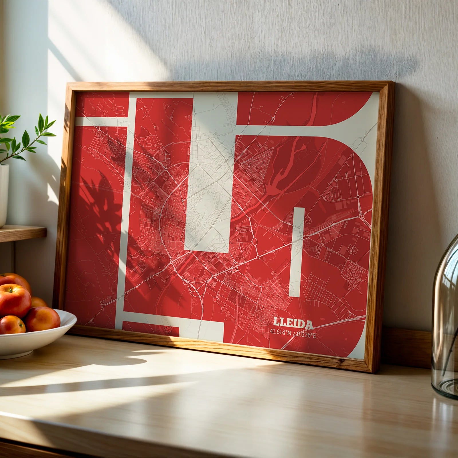 Modern interior design with a Lleida in Inseparable design, featuring the city's abbreviation in expressive typography over a detailed urban map designed in red and an off-white background, displayed on a living room wall