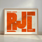 Framed Logroño in Inseparable design, featuring the city's abbreviation in expressive typography over a detailed urban map designed in orange and an off-white background with a white margin border in a warm lit minimalist setting
