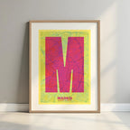 Framed Madrid in Super Bold design, a typographic poster where the city map is overlaid with extra-thick lettering for a modern, high-impact look designed in yellow and fuchsia with a white margin border in a warm lit minimalist setting