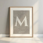 Framed Madrid in Classic design, inspired by chiseled typography with an elegant font that creates a beautiful visual contrast designed in light brown and an off-white background with a white margin border in a warm lit minimalist setting