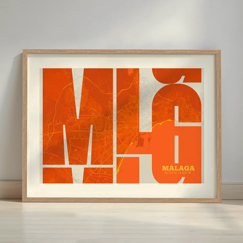 Framed Malaga in Inseparable design, featuring the city's abbreviation in expressive typography over a detailed urban map designed in orange and an off-white background with a white margin border in a warm lit minimalist setting