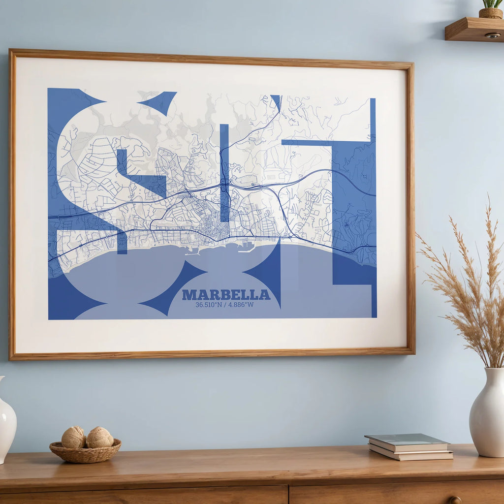 Modern interior design with a Marbella in Inseparable design, featuring the city's abbreviation in expressive typography over a detailed urban map designed in navy blue and white, displayed on a living room wall