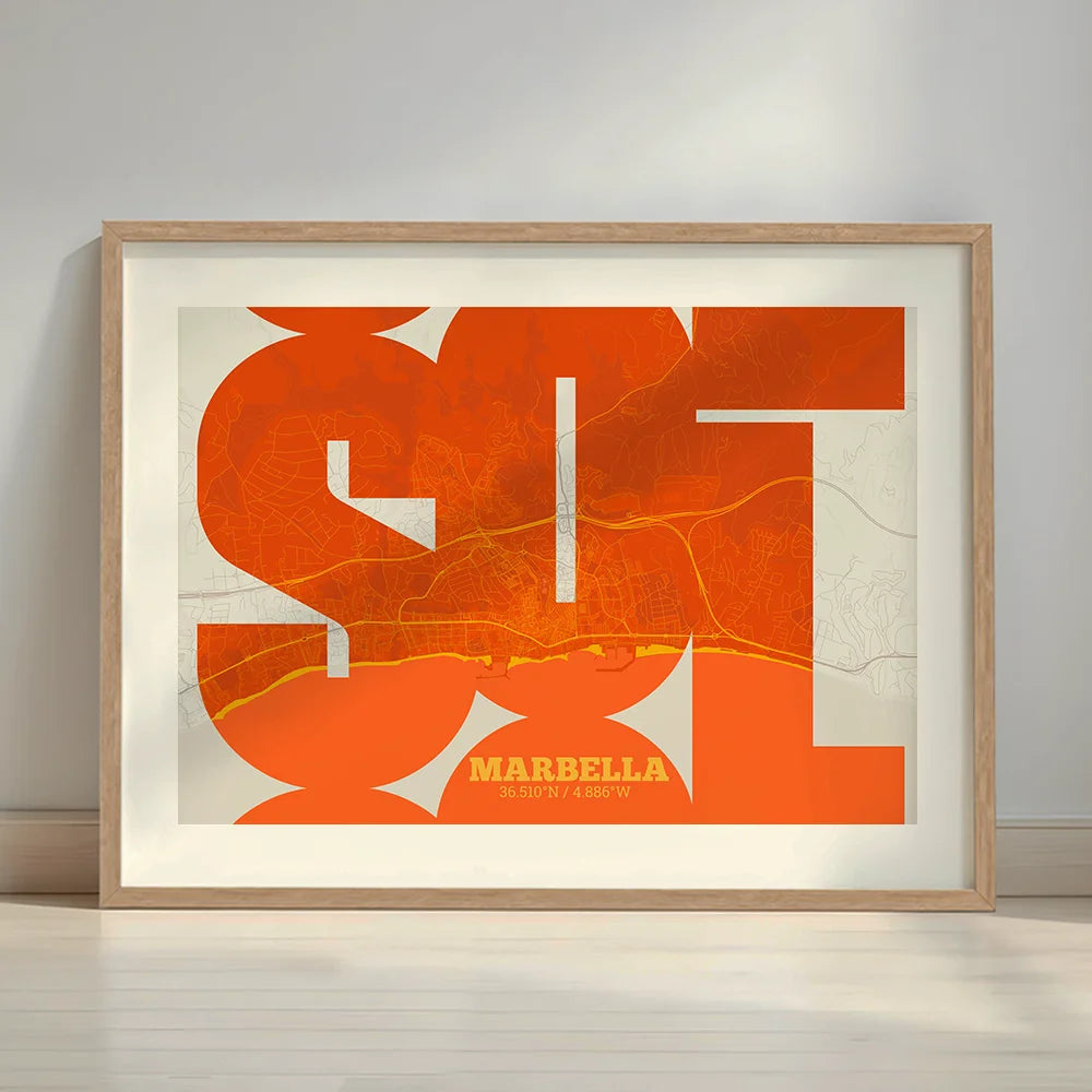Framed Marbella in Inseparable design, featuring the city's abbreviation in expressive typography over a detailed urban map designed in orange and an off-white background with a white margin border in a warm lit minimalist setting