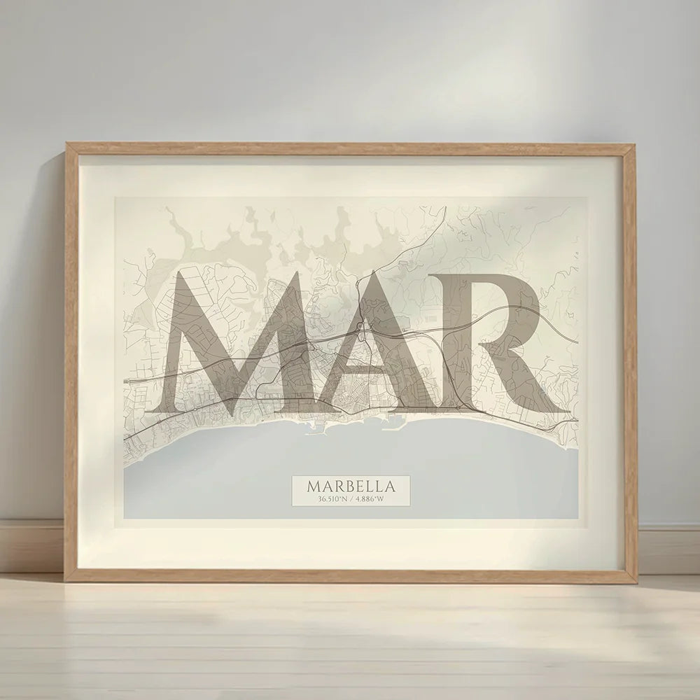 Framed Marbella in Classic design, inspired by chiseled typography with an elegant font that creates a beautiful visual contrast designed in light brown and an off-white background with a white margin border in a warm lit minimalist setting