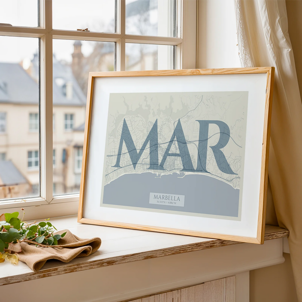 Modern interior design with a Marbella in Classic design, inspired by chiseled typography with an elegant font that creates a beautiful visual contrast designed in bluish gray and an off-white background, displayed on a living room wall