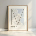 Framed Melilla in Ultralight design, a minimalist aesthetic combining urban cartography with modern, extra-thin elegant lettering designed in light brown and an off-white background with a white margin border in a warm lit minimalist setting
