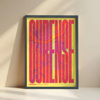 Framed Ourense in Extra Compressed design, where the letters are tightly squeezed to fit the city's map shape designed in yellow and fuchsia with no border edge-to-edge print leaning against a wall