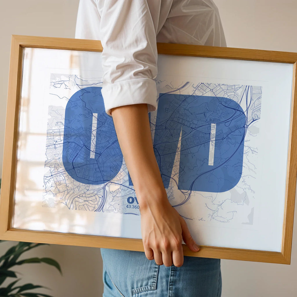 Modern interior design with a Oviedo in Super Bold design, a typographic poster where the city map is overlaid with extra-thick lettering for a modern, high-impact look designed in navy blue and white, displayed on a living room wall