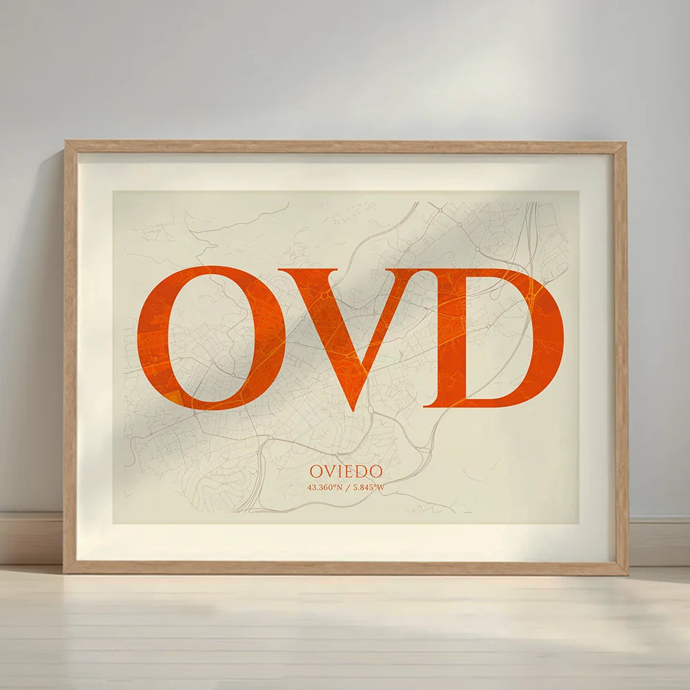 Framed Oviedo in Classic design, inspired by chiseled typography with an elegant font that creates a beautiful visual contrast designed in orange and an off-white background with a white margin border in a warm lit minimalist setting
