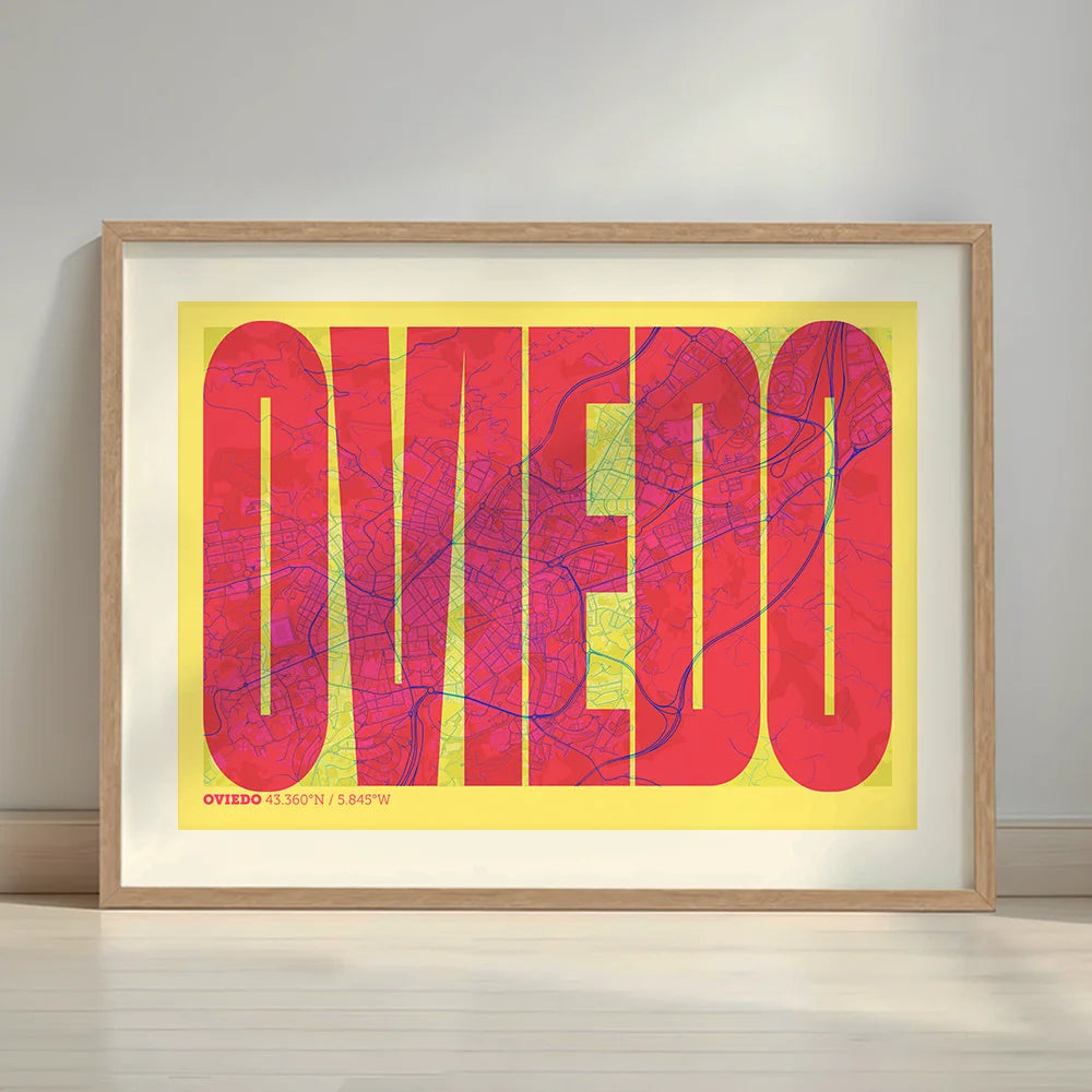 Framed Oviedo in Extra Compressed design, where the letters are tightly squeezed to fit the city's map shape designed in yellow and fuchsia with a white margin border in a warm lit minimalist setting