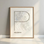 Framed Palencia in Ultralight design, a minimalist aesthetic combining urban cartography with modern, extra-thin elegant lettering designed in light brown and an off-white background with a white margin border in a warm lit minimalist setting