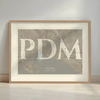 Framed Palma in Classic design, inspired by chiseled typography with an elegant font that creates a beautiful visual contrast designed in light brown and an off-white background with a white margin border in a warm lit minimalist setting