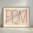 Framed Palma in Ultralight design, a minimalist aesthetic combining urban cartography with modern, extra-thin elegant lettering designed in red and an off-white background with a white margin border in a warm lit minimalist setting