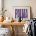 Modern interior design with a Palma in Extra Compressed design, where the letters are tightly squeezed to fit the city's map shape designed in purple and light blue, displayed on a living room wall