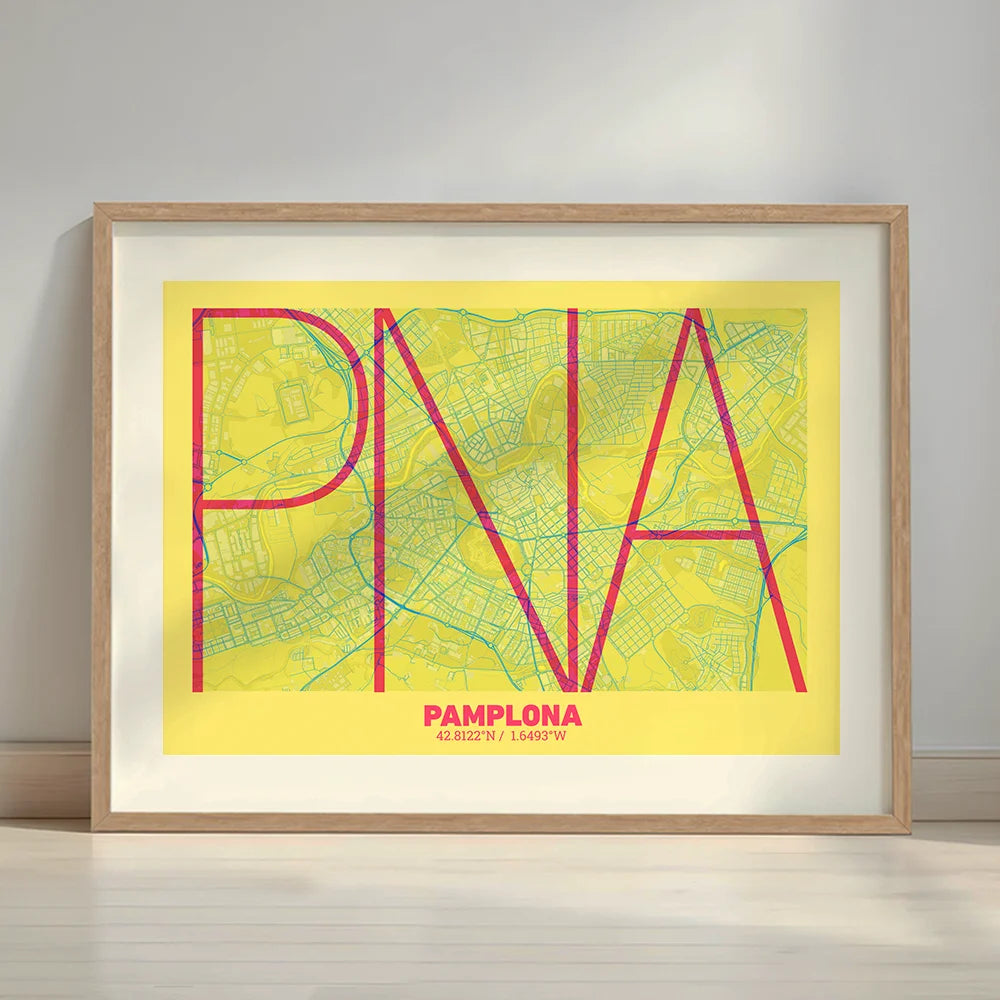 Framed Pamplona in Ultralight design, a minimalist aesthetic combining urban cartography with modern, extra-thin elegant lettering designed in yellow and fuchsia with a white margin border in a warm lit minimalist setting