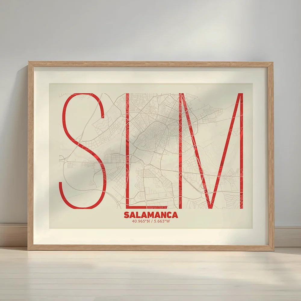 Framed Salamanca in Ultralight design, a minimalist aesthetic combining urban cartography with modern, extra-thin elegant lettering designed in red and an off-white background with a white margin border in a warm lit minimalist setting