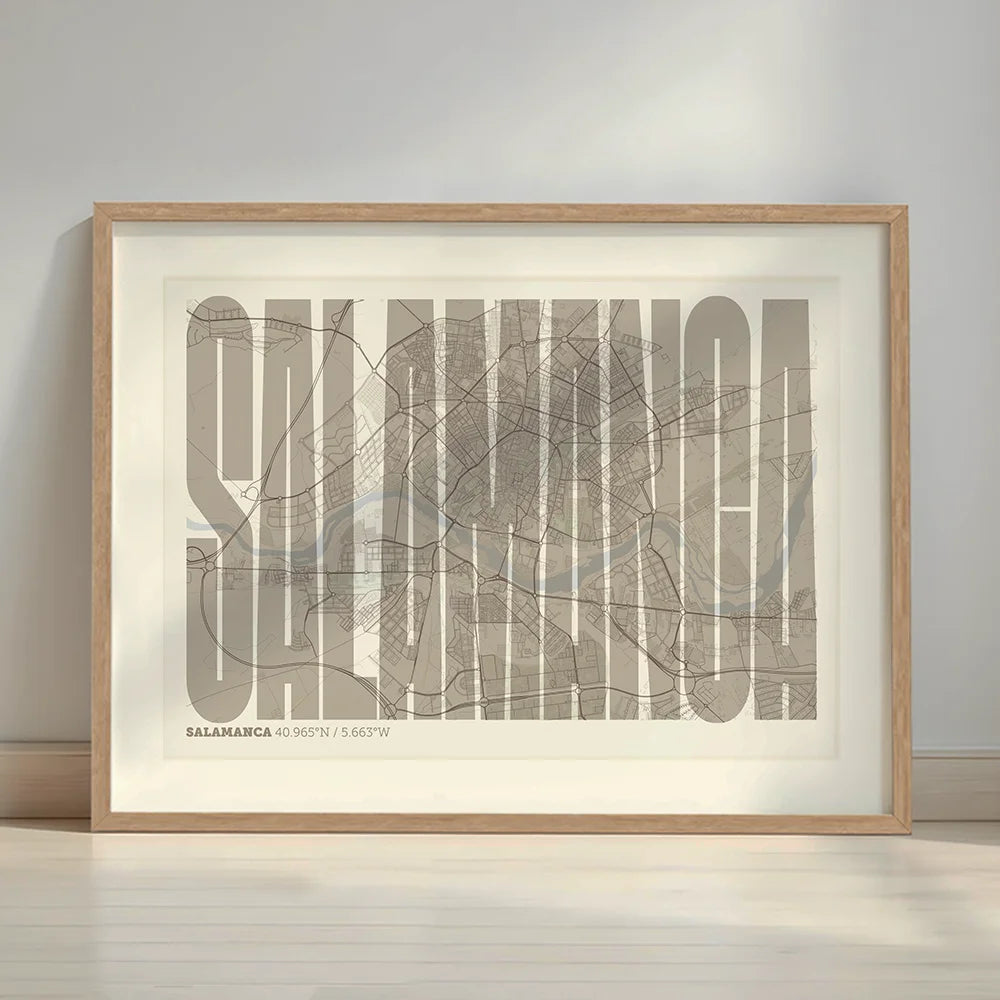 Framed Salamanca in Extra Compressed design, where the letters are tightly squeezed to fit the city's map shape designed in light brown and an off-white background with a white margin border in a warm lit minimalist setting