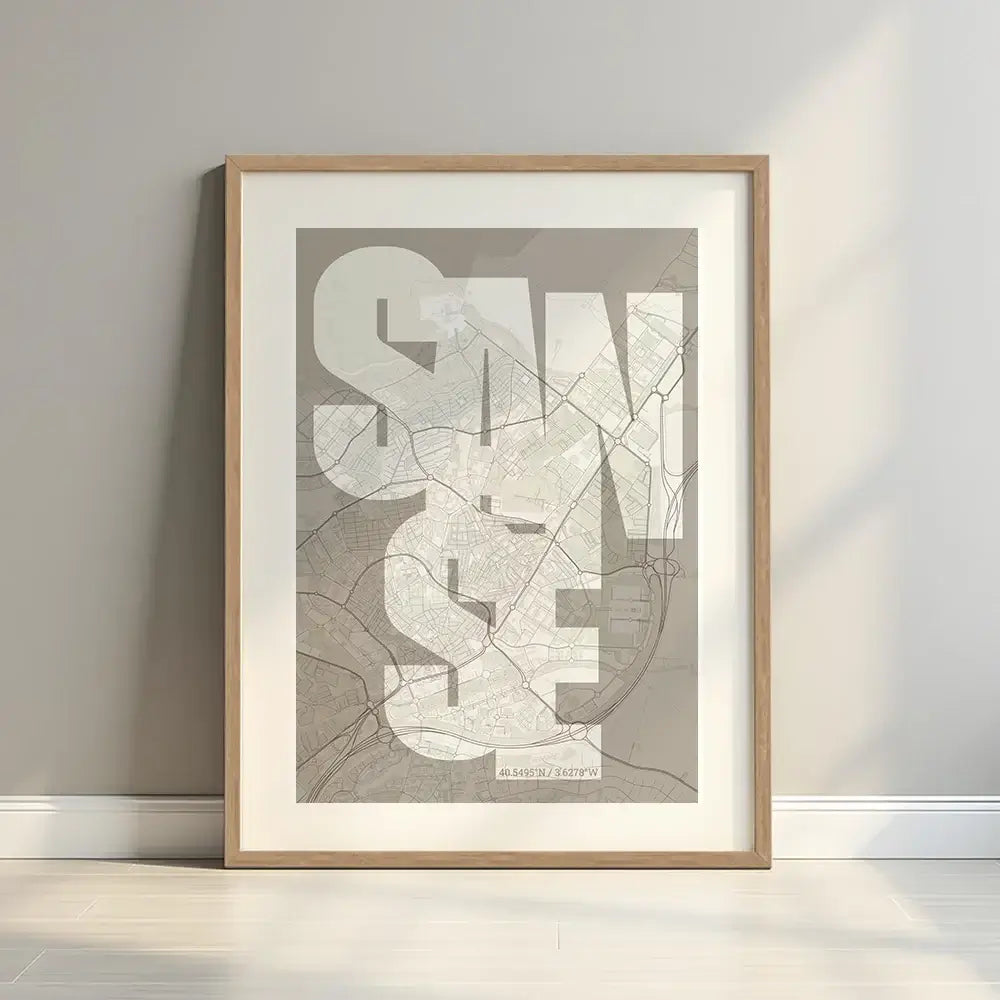 Framed San Sebastian de los Reyes in Inseparable design, featuring the city's abbreviation in expressive typography over a detailed urban map designed in light brown and an off-white background with a white margin border in a warm lit minimalist setting