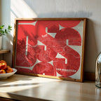 Modern interior design with a San Sebastian in Inseparable design, featuring the city's abbreviation in expressive typography over a detailed urban map designed in red and an off-white background, displayed on a living room wall