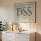Modern interior design with a San Sebastian in Classic design, inspired by chiseled typography with an elegant font that creates a beautiful visual contrast designed in bluish gray and an off-white background, displayed on a living room wall