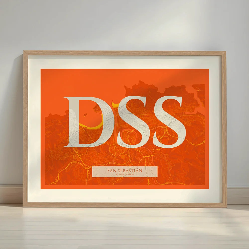 Framed San Sebastian in Classic design, inspired by chiseled typography with an elegant font that creates a beautiful visual contrast designed in orange and an off-white background with a white margin border in a warm lit minimalist setting