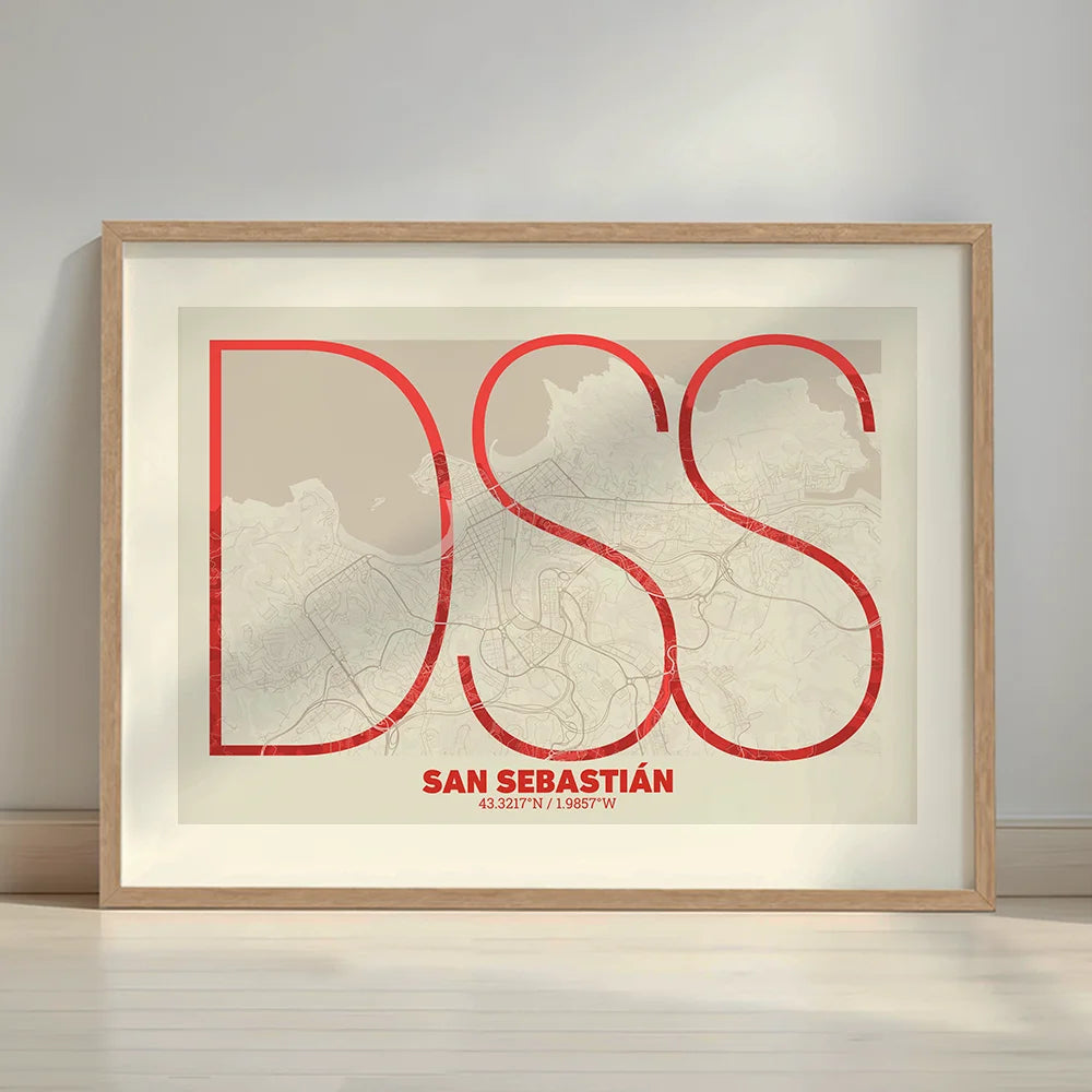 Framed San Sebastian in Ultralight design, a minimalist aesthetic combining urban cartography with modern, extra-thin elegant lettering designed in red and an off-white background with a white margin border in a warm lit minimalist setting