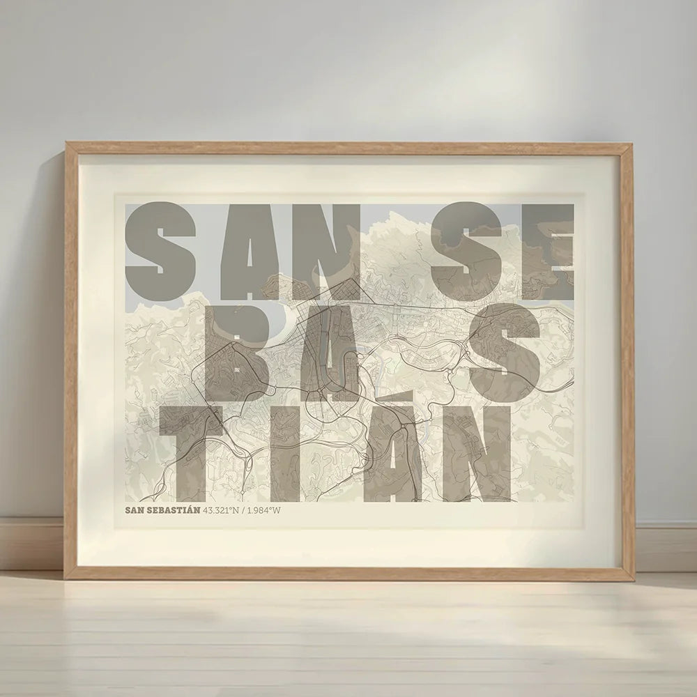 Framed San Sebastian in Unruled design, where the city name letters appear randomly across different lines for a truly original urban layout designed in light brown and an off-white background with a white margin border in a warm lit minimalist setting