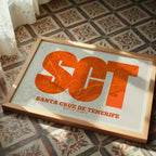Modern interior design with a Santa Cruz de Tenerife in Super Bold design, a typographic poster where the city map is overlaid with extra-thick lettering for a modern, high-impact look designed in orange and an off-white background, displayed on a living room wall