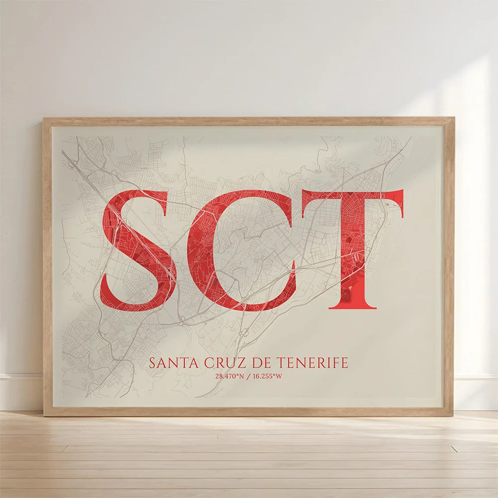 Framed Santa Cruz de Tenerife in Classic design, inspired by chiseled typography with an elegant font that creates a beautiful visual contrast designed in red and an off-white background with no border edge-to-edge print leaning against a wall