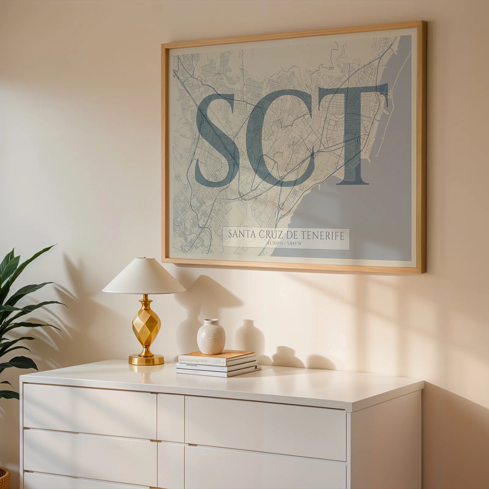 Modern interior design with a Santa Cruz de Tenerife in Classic design, inspired by chiseled typography with an elegant font that creates a beautiful visual contrast designed in bluish gray and an off-white background, displayed on a living room wall