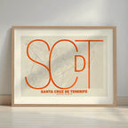 Framed Santa Cruz de Tenerife in Ultralight design, a minimalist aesthetic combining urban cartography with modern, extra-thin elegant lettering designed in orange and an off-white background with a white margin border in a warm lit minimalist setting