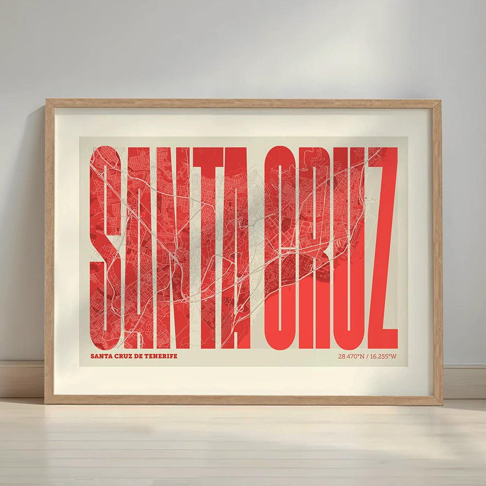 Framed Santa Cruz de Tenerife in Extra Compressed design, where the letters are tightly squeezed to fit the city's map shape designed in red and an off-white background with a white margin border in a warm lit minimalist setting