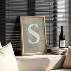Modern interior design with a Segovia in Classic design, inspired by chiseled typography with an elegant font that creates a beautiful visual contrast designed in light brown and an off-white background, displayed on a living room wall