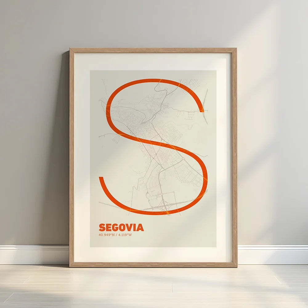 Framed Segovia in Ultralight design, a minimalist aesthetic combining urban cartography with modern, extra-thin elegant lettering designed in orange and an off-white background with a white margin border in a warm lit minimalist setting