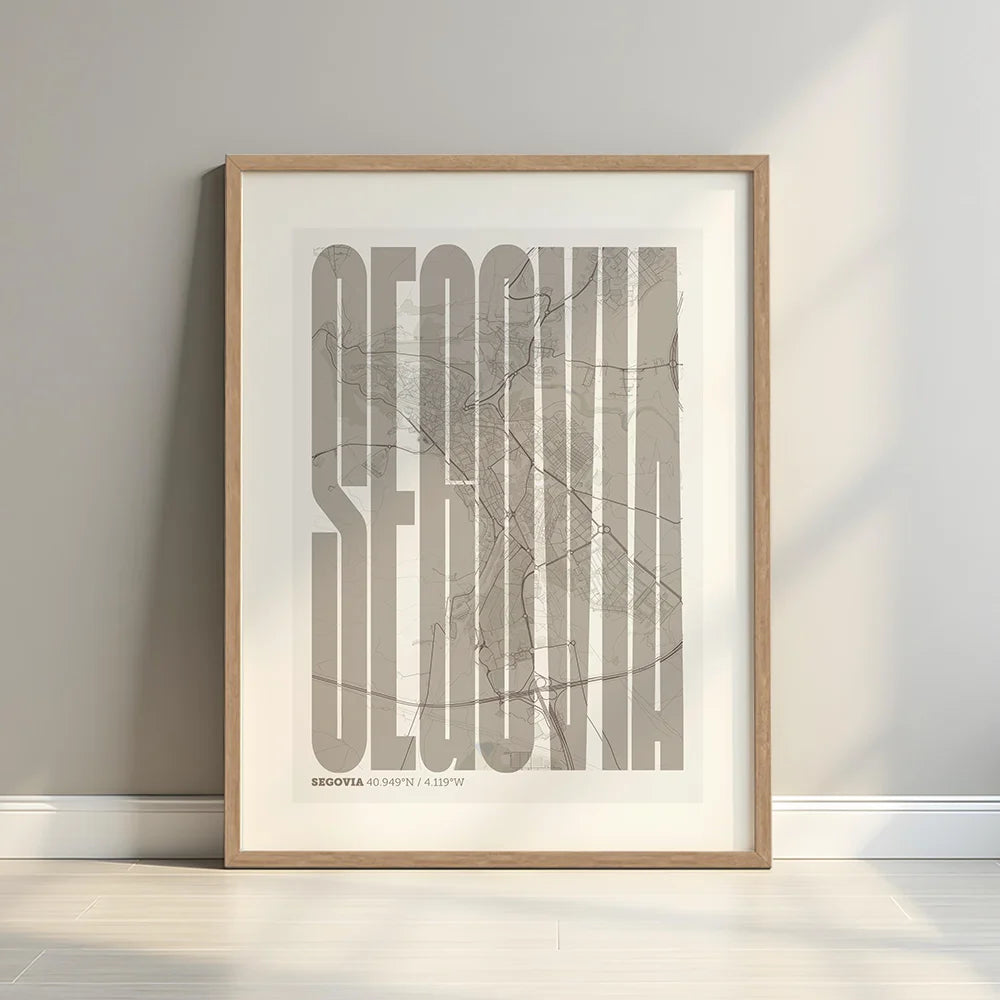 Framed Segovia in Extra Compressed design, where the letters are tightly squeezed to fit the city's map shape designed in light brown and an off-white background with a white margin border in a warm lit minimalist setting