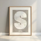 Framed Soria in Super Bold design, a typographic poster where the city map is overlaid with extra-thick lettering for a modern, high-impact look designed in light brown and an off-white background with a white margin border in a warm lit minimalist setting