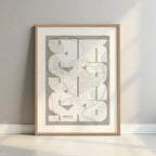 Framed Soria in Inseparable design, featuring the city's abbreviation in expressive typography over a detailed urban map designed in light brown and an off-white background with a white margin border in a warm lit minimalist setting