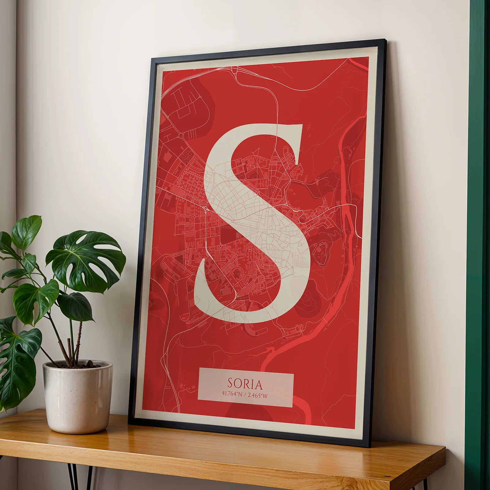 Modern interior design with a Soria in Classic design, inspired by chiseled typography with an elegant font that creates a beautiful visual contrast designed in red and an off-white background, displayed on a living room wall