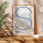 Modern interior design with a Soria in Ultralight design, a minimalist aesthetic combining urban cartography with modern, extra-thin elegant lettering designed in navy blue and white, displayed on a living room wall