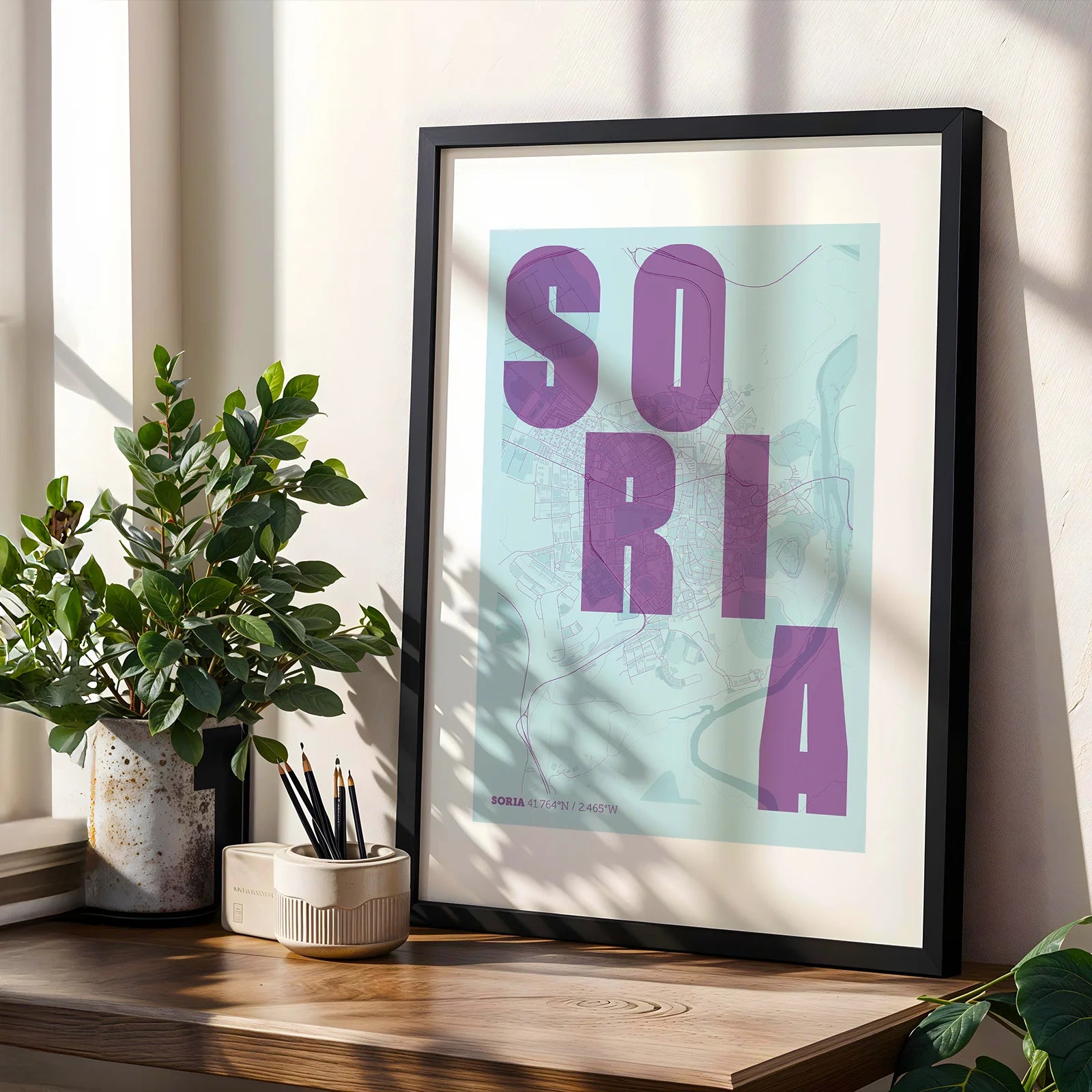 Modern interior design with a Soria in Unruled design, where the city name letters appear randomly across different lines for a truly original urban layout designed in purple and light blue, displayed on a living room wall