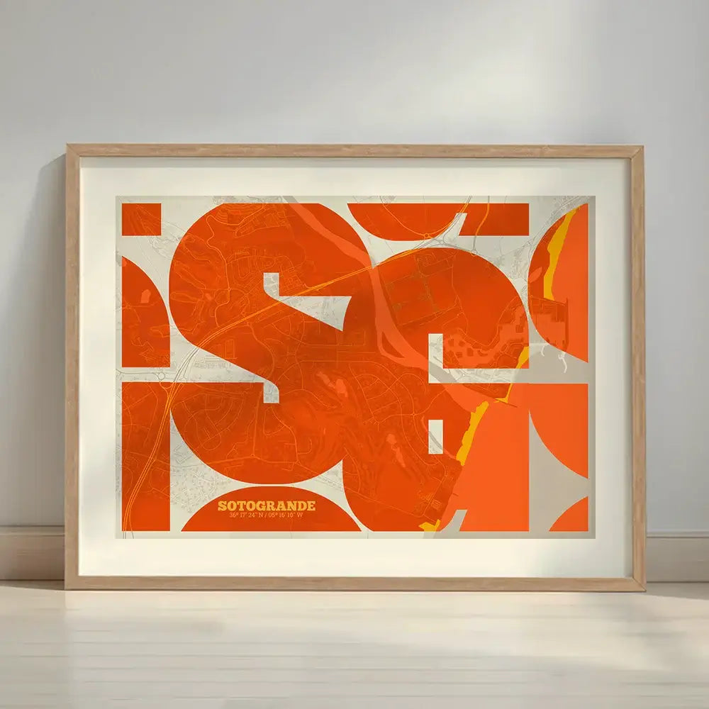 Framed Sotogrande in Inseparable design, featuring the city's abbreviation in expressive typography over a detailed urban map designed in orange and an off-white background with a white margin border in a warm lit minimalist setting