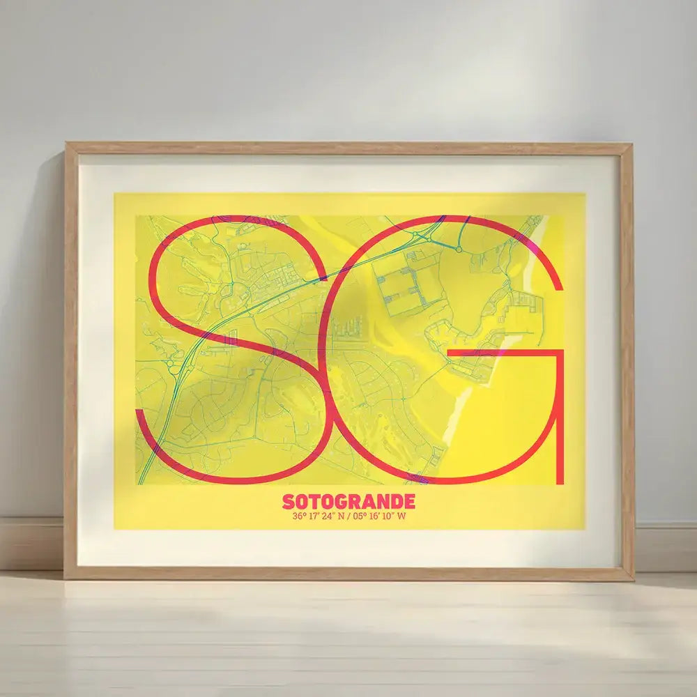 Framed Sotogrande in Ultralight design, a minimalist aesthetic combining urban cartography with modern, extra-thin elegant lettering designed in yellow and fuchsia with a white margin border in a warm lit minimalist setting