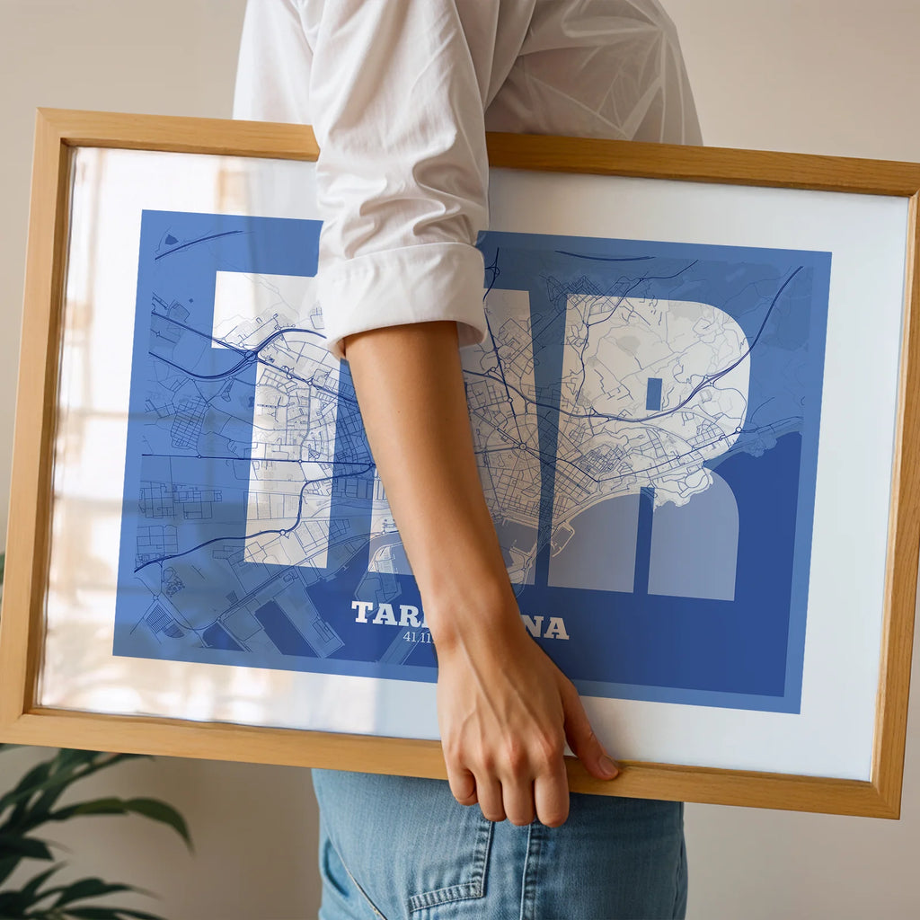 Modern interior design with a Tarragona in Super Bold design, a typographic poster where the city map is overlaid with extra-thick lettering for a modern, high-impact look designed in navy blue and white, displayed on a living room wall