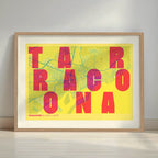 Framed Tarragona in Unruled design, where the city name letters appear randomly across different lines for a truly original urban layout designed in yellow and fuchsia with a white margin border in a warm lit minimalist setting