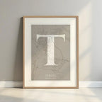 Framed Teruel in Classic design, inspired by chiseled typography with an elegant font that creates a beautiful visual contrast designed in light brown and an off-white background with a white margin border in a warm lit minimalist setting