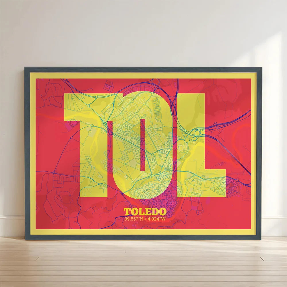 Framed Toledo in Super Bold design, a typographic poster where the city map is overlaid with extra-thick lettering for a modern, high-impact look designed in yellow and fuchsia with no border edge-to-edge print leaning against a wall
