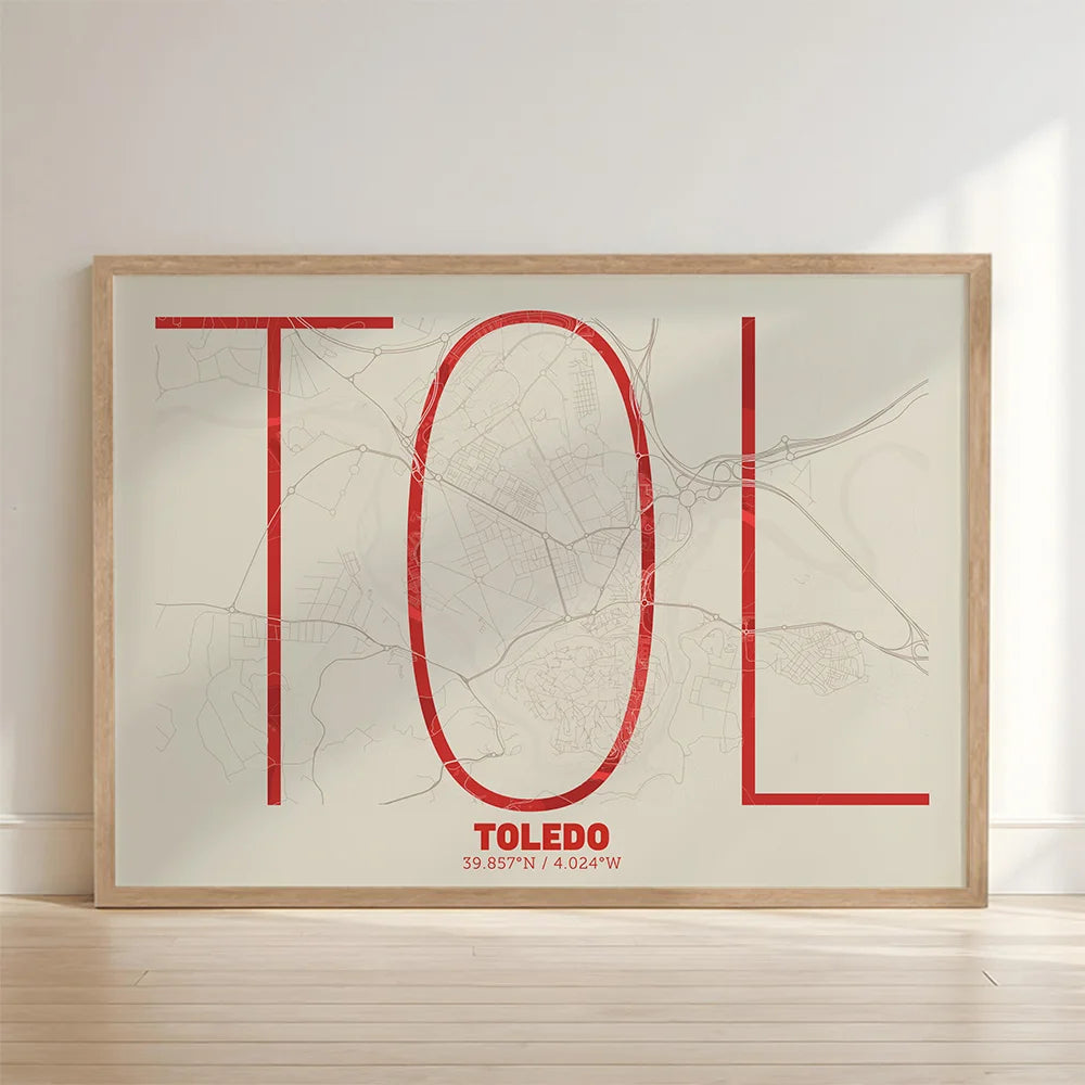Framed Toledo in Ultralight design, a minimalist aesthetic combining urban cartography with modern, extra-thin elegant lettering designed in red and an off-white background with no border edge-to-edge print leaning against a wall