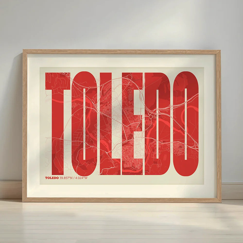 Framed Toledo in Extra Compressed design, where the letters are tightly squeezed to fit the city's map shape designed in red and an off-white background with a white margin border in a warm lit minimalist setting